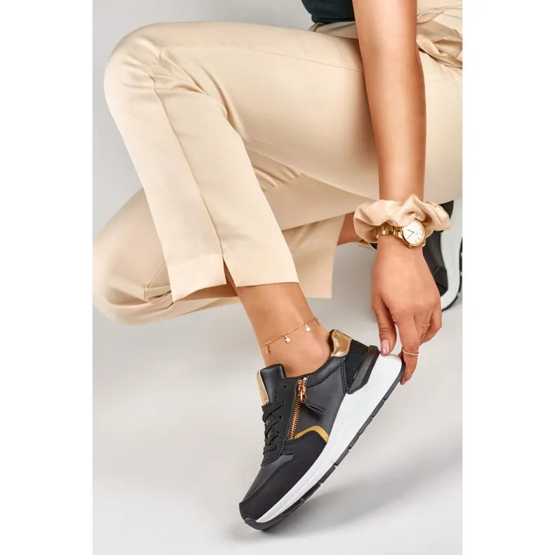 Chaussures de sport pour femmes noires avec une fermeture éclair dorée le noir